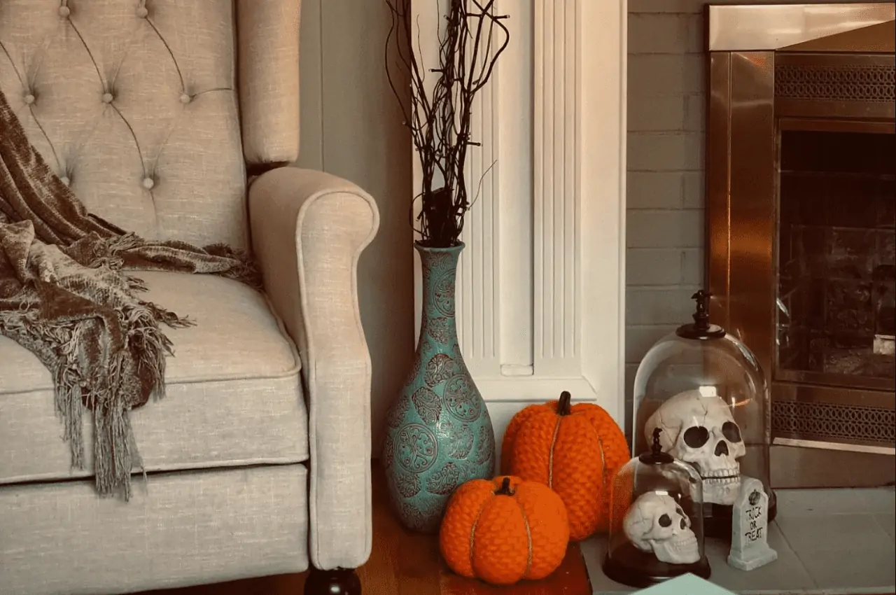 Halloween decorations by a fireplace