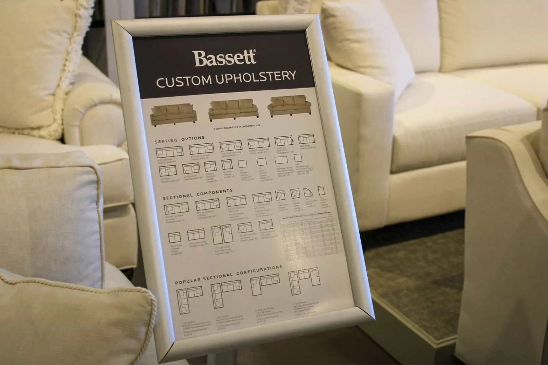 A sign about Bassett custom upholstery options in Woodchuck's Furniture showroom