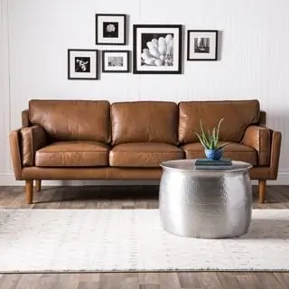 brown leather couch in black and white living room