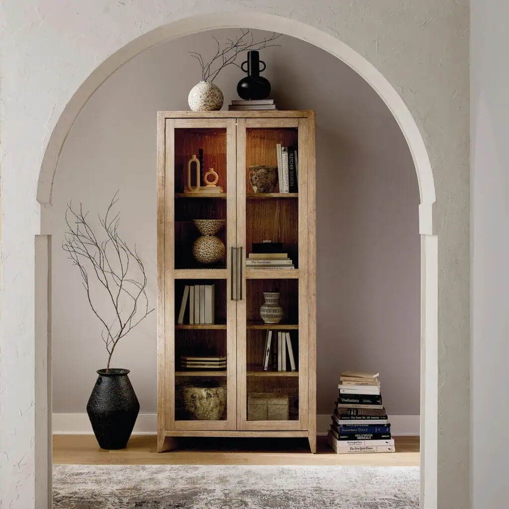 Bassett stand up cabinet for home office with books and decor