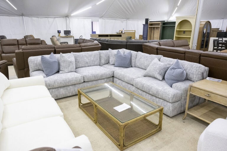 Grey Bernhardt three piece sectional with glass top coffee table