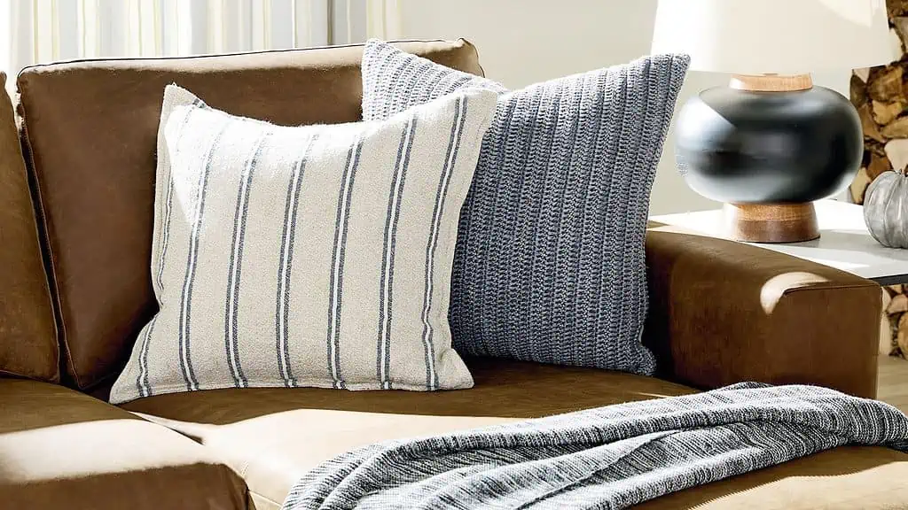 Pillows and a throw blanket on a sofa