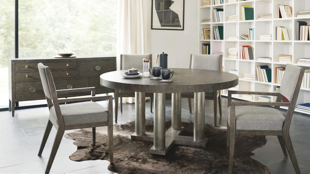 A Bernhardt dark gray stone dining set with four chairs