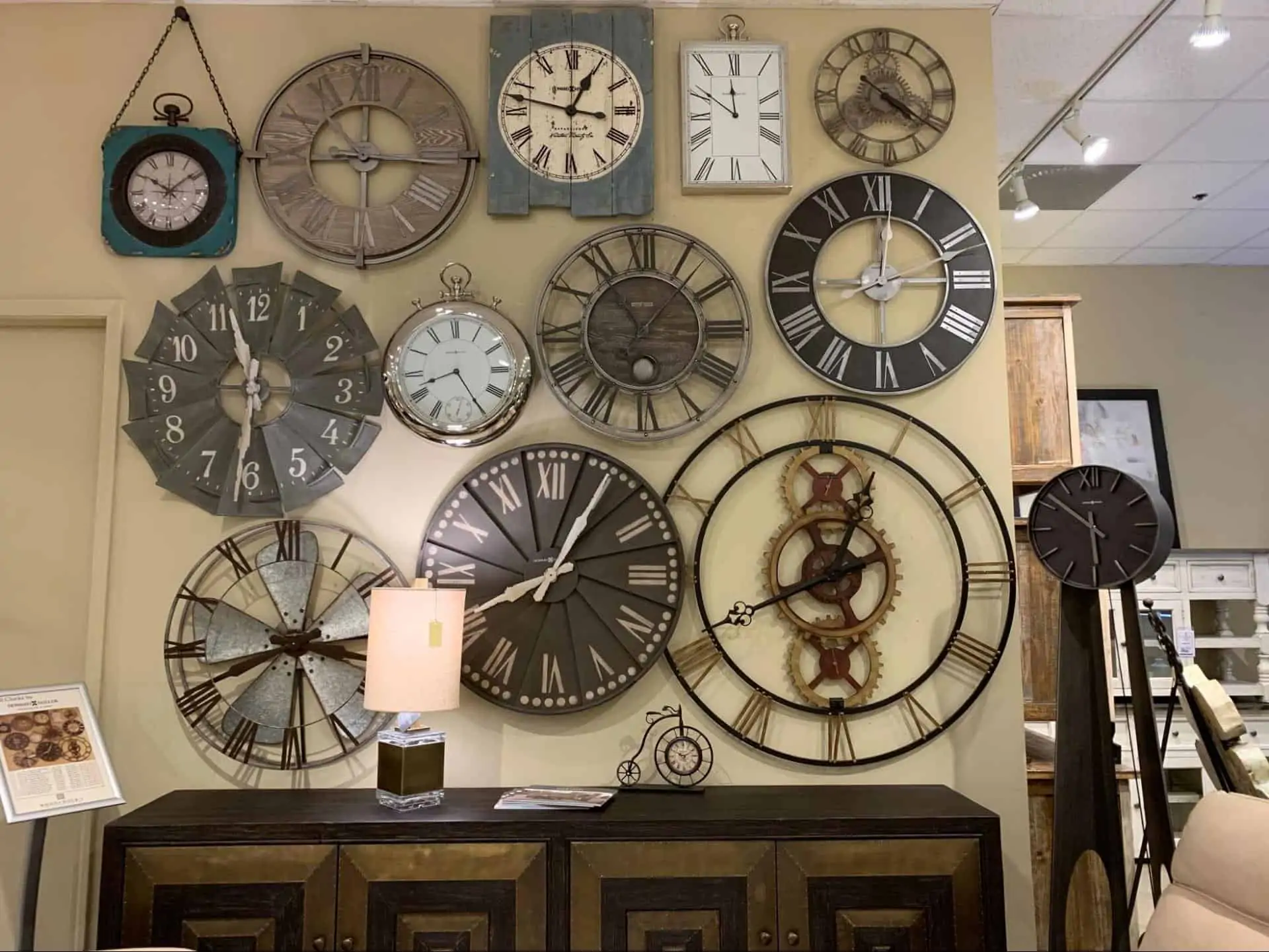 Several clocks on a wall at Woodchuck's Furniture showroom