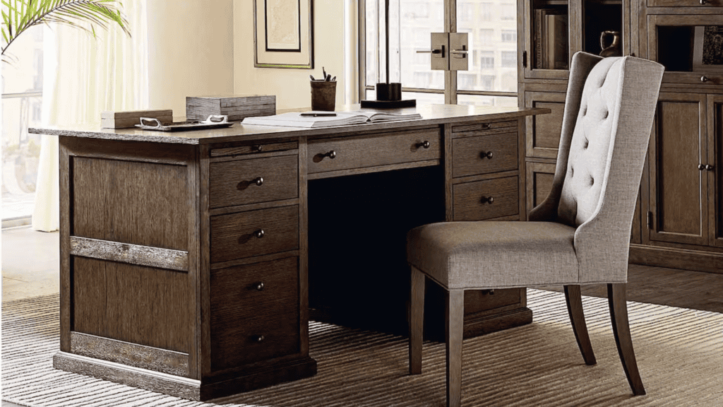 Dark brown wood desk with an upholstered chair 