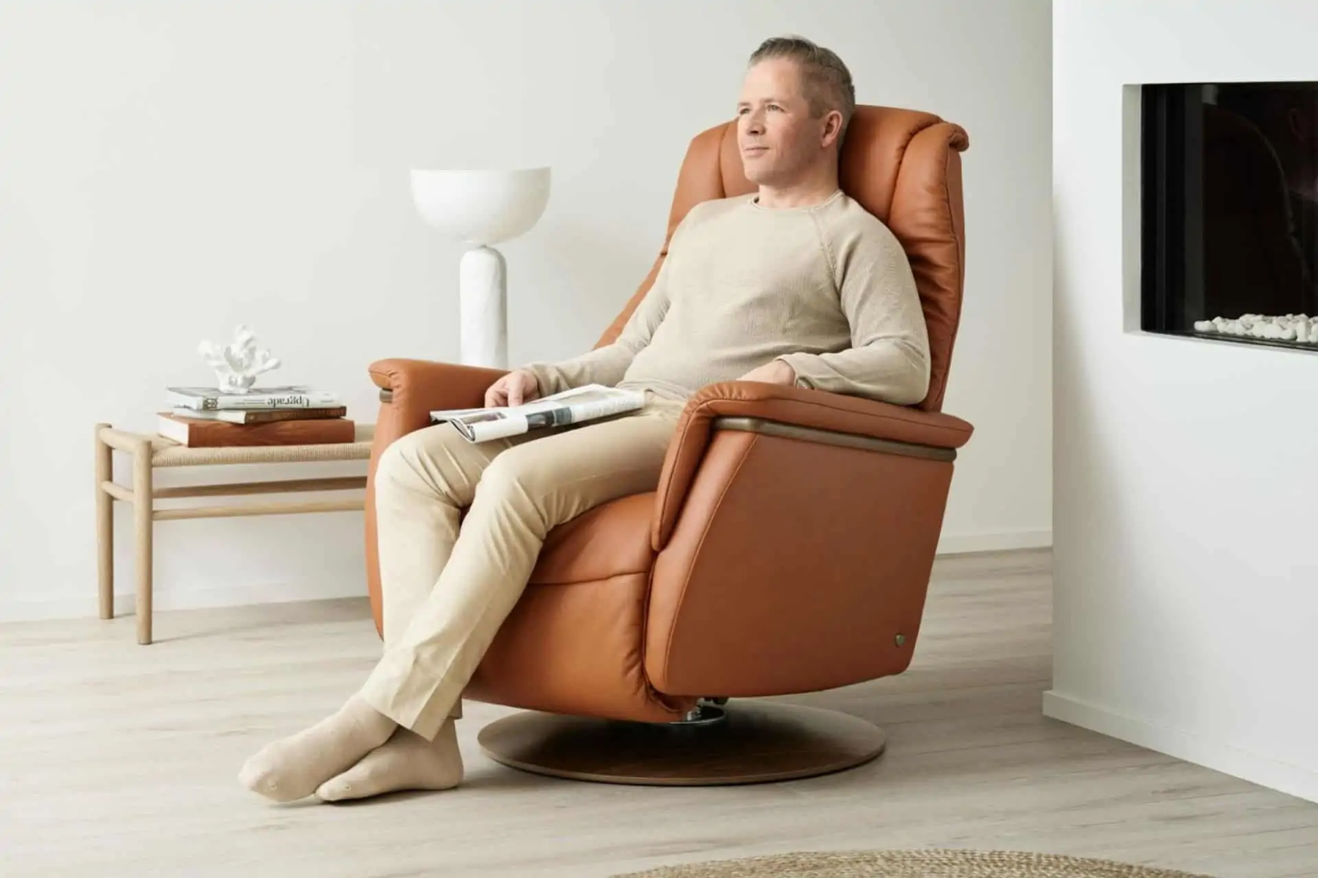 A man sits in a Stressless recliner