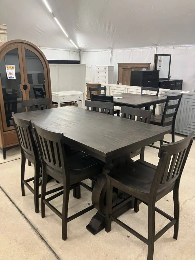 dark wood bar height rectangular dining table with six chairs