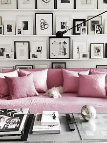 neon pink sofa in white and black room