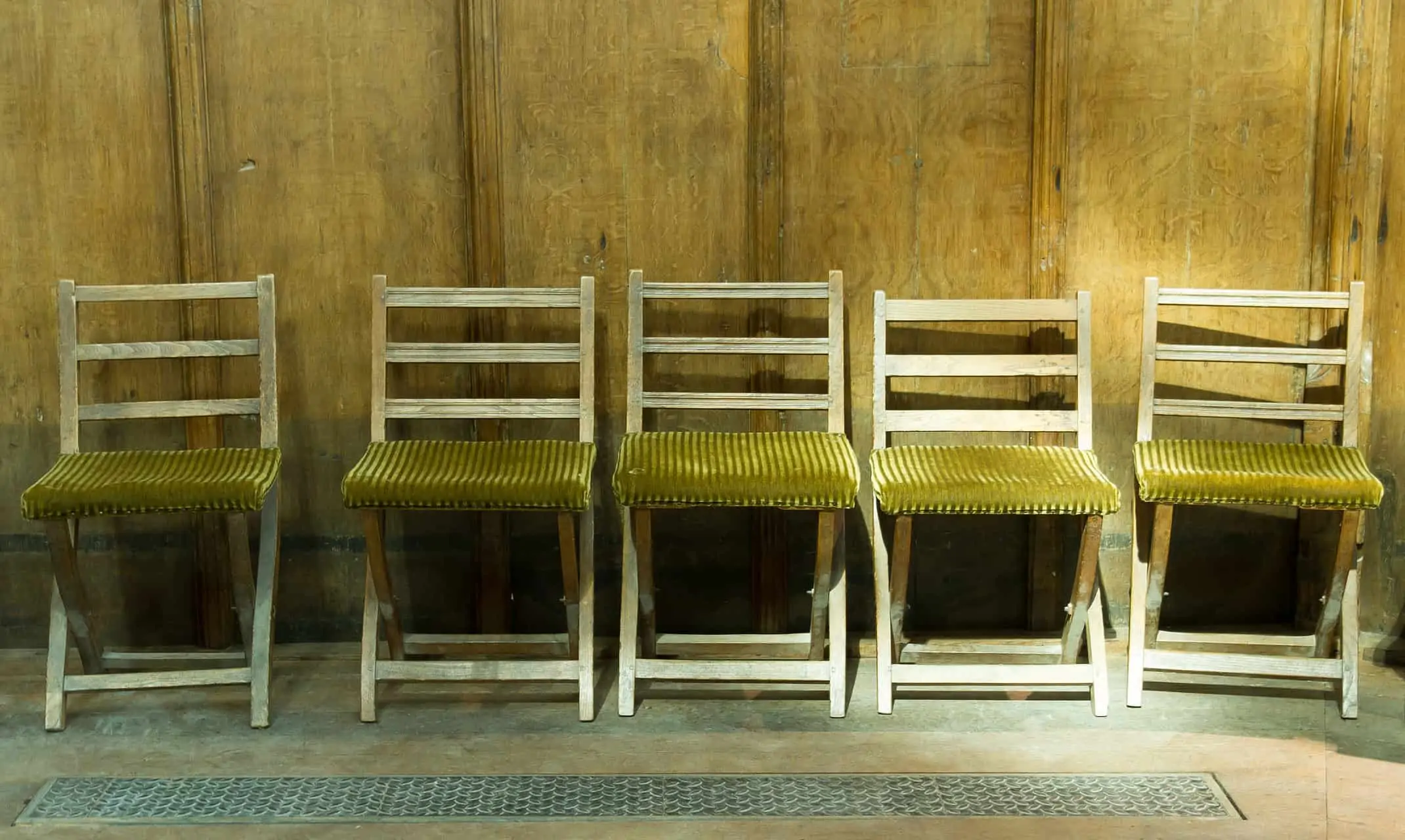 Row of very old chairs in a dutch church