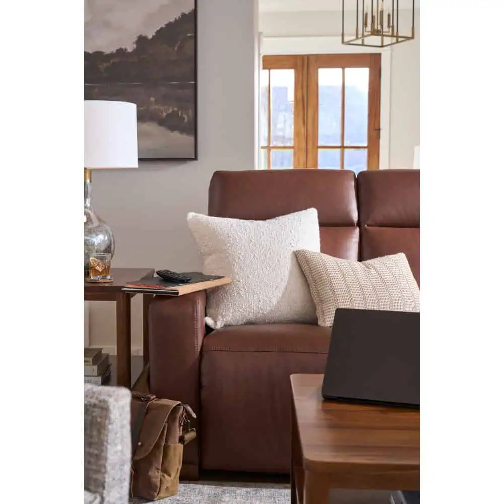 brown lay-z-boy couch with pillows in lived in home