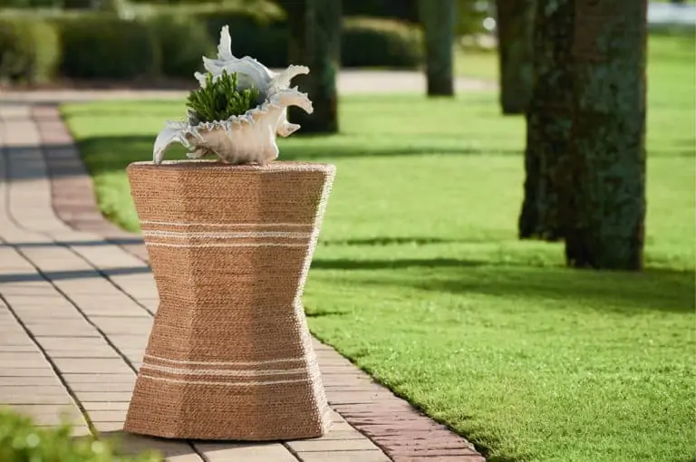 wicker table conch shell outside grass