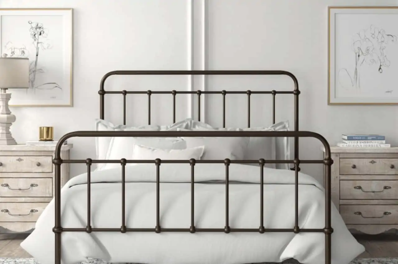 a metal-framed bed in a bedroom