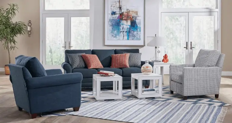 living room white and blue theme red statement color