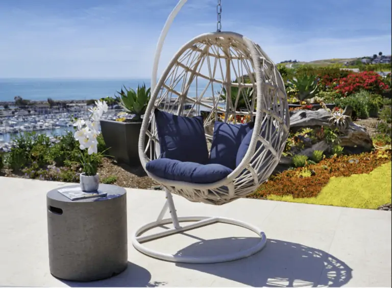 outdoor hanging egg chair overlooking ocean