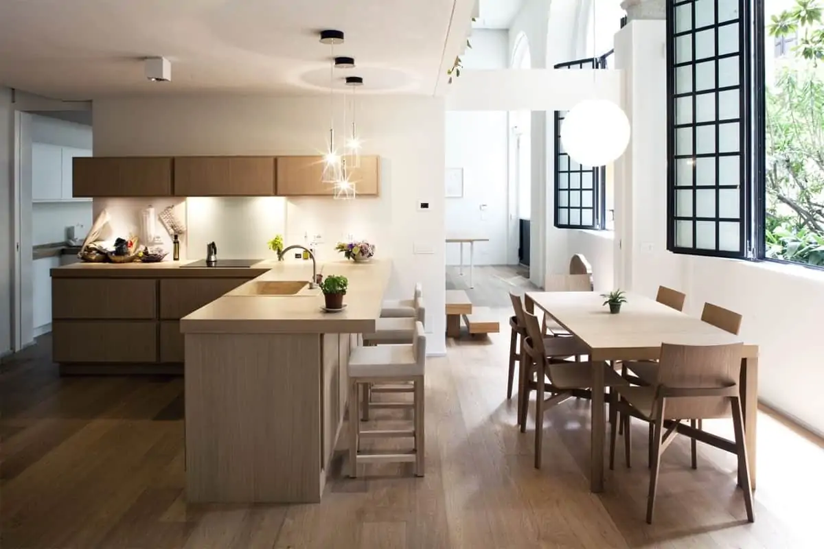 open kitchen with lighting over the bar area and dining area