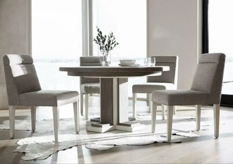 grey dining room circle table and four chairs