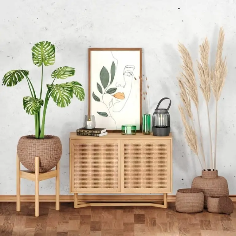 A table, artwork and fake plants