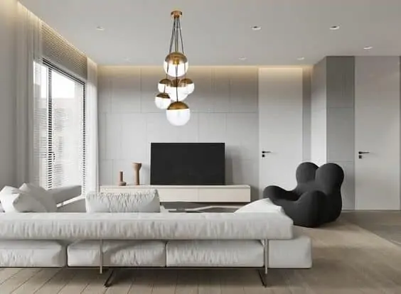 minimalist living room with low sofa and modern light fixture