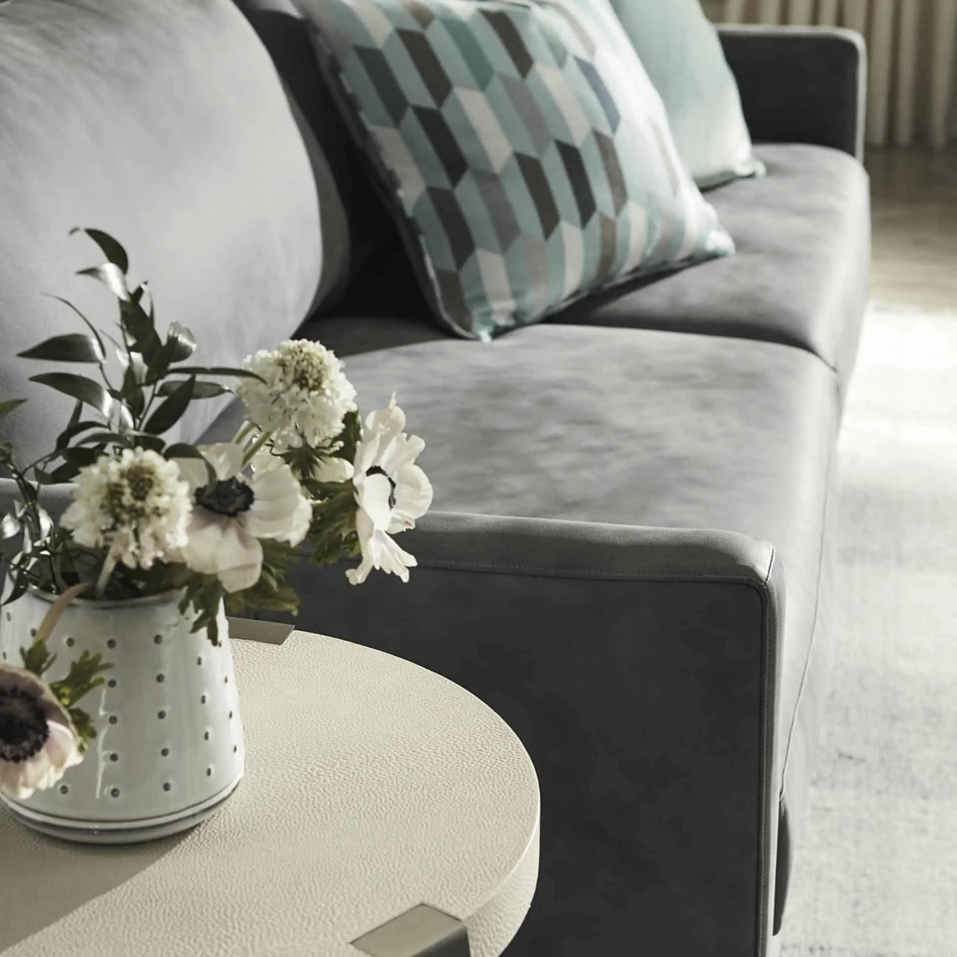 coffee table corner with bouquet of flowers