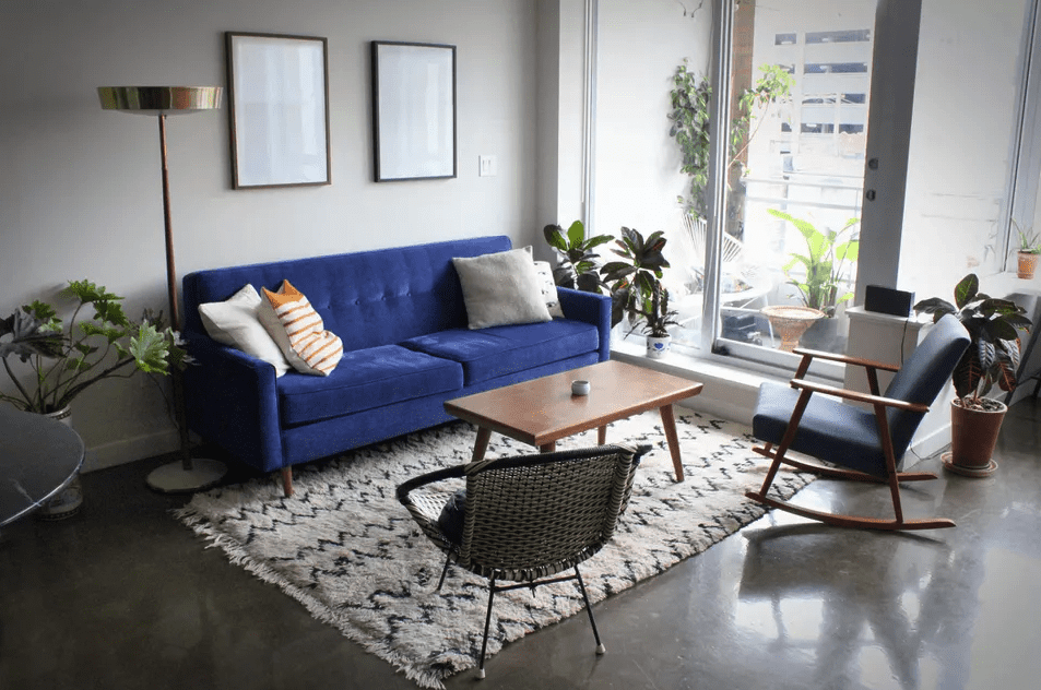 living room with royal blue sofa